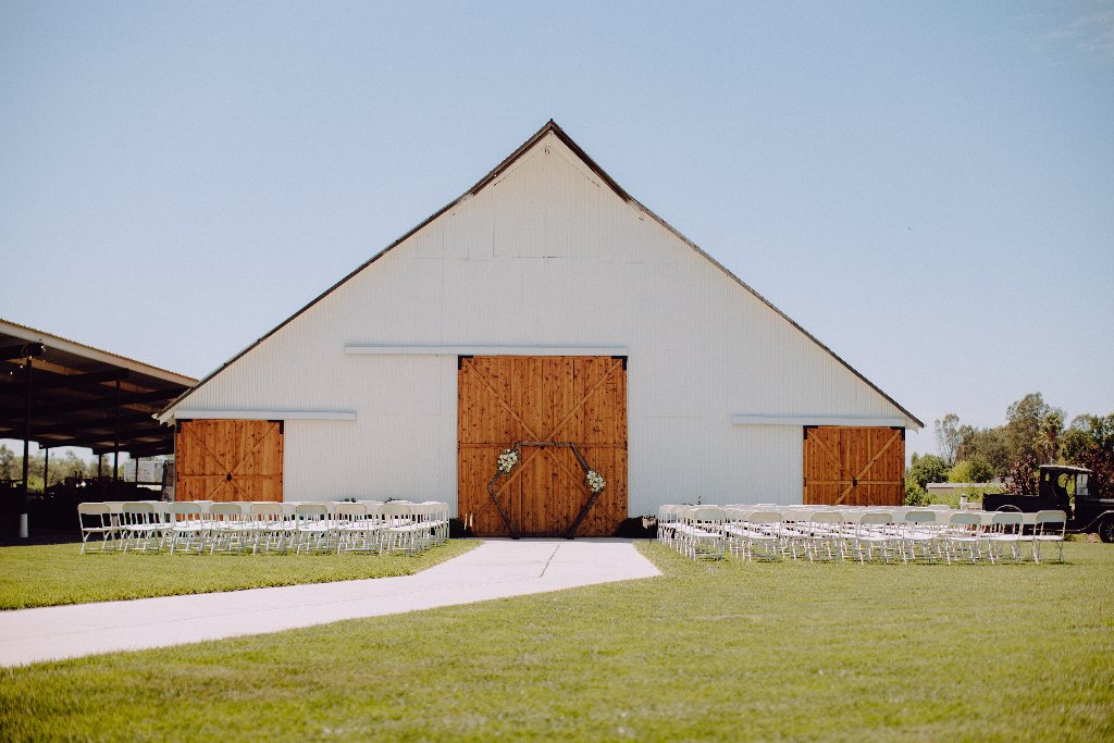 Couple Walking at White Barn