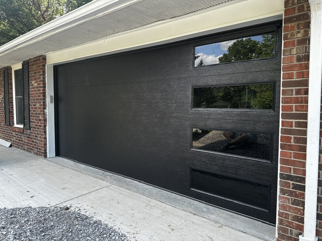 Sleek modern black door after