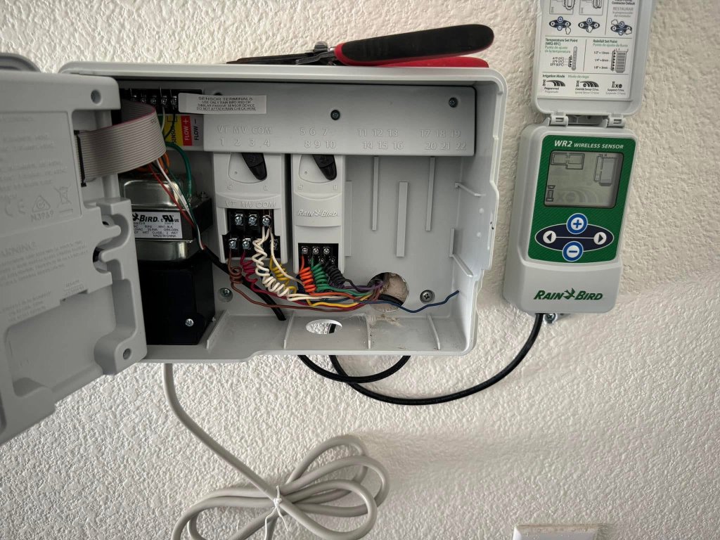Rain Bird wireless sensor connected to sprinkler controller