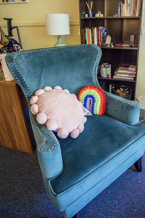 Cozy therapy chair with welcoming decor in Corvallis office