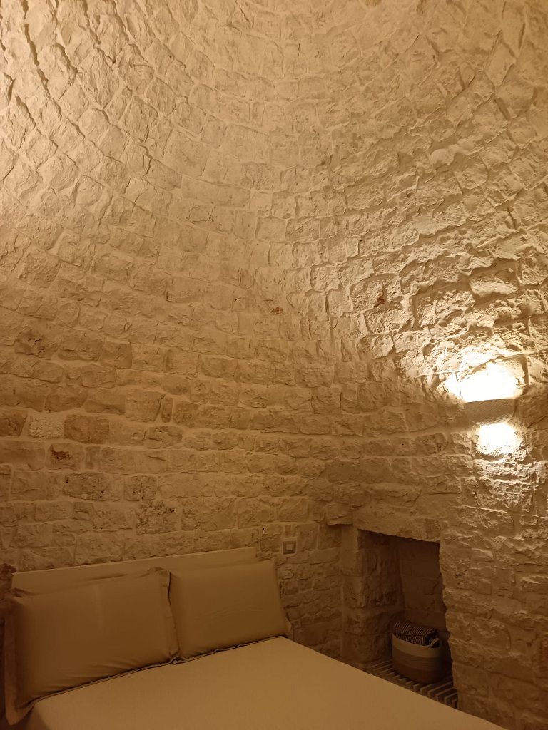 Bedroom under trulli cone