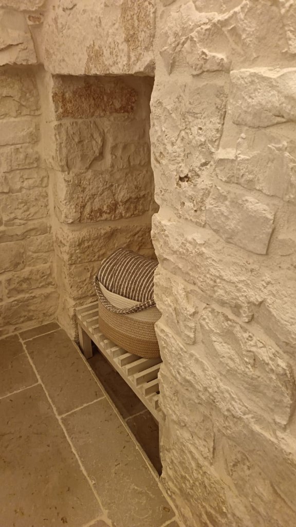 Stone niche with woven baskets