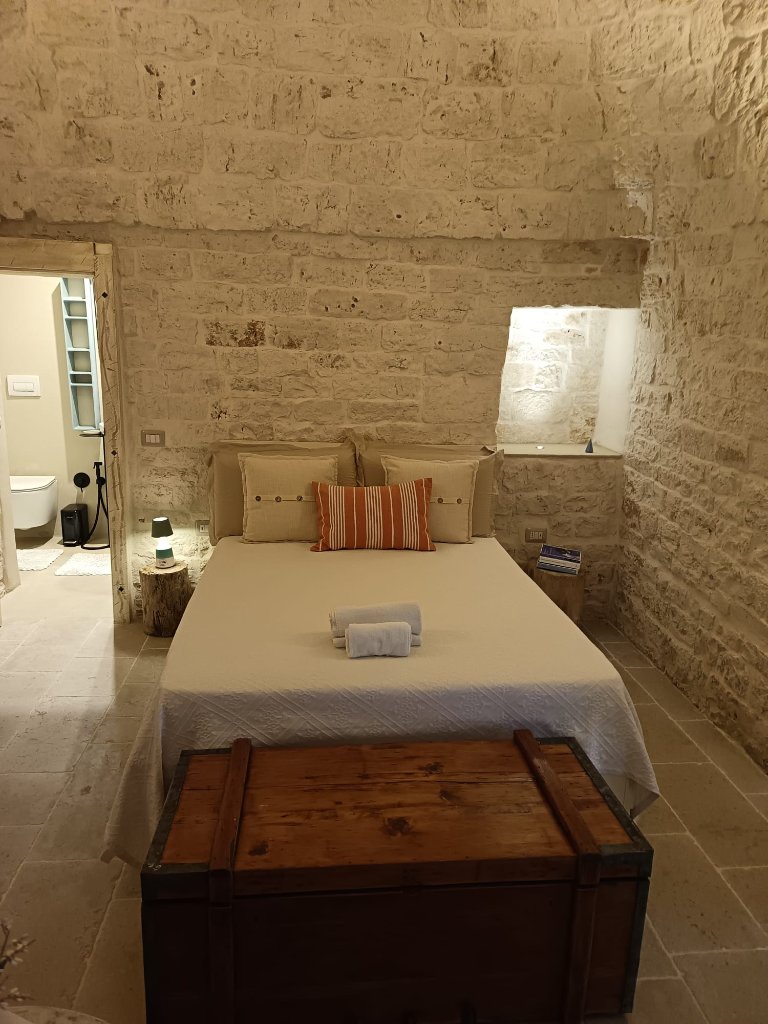 Serene stone bedroom with minimalist elegance