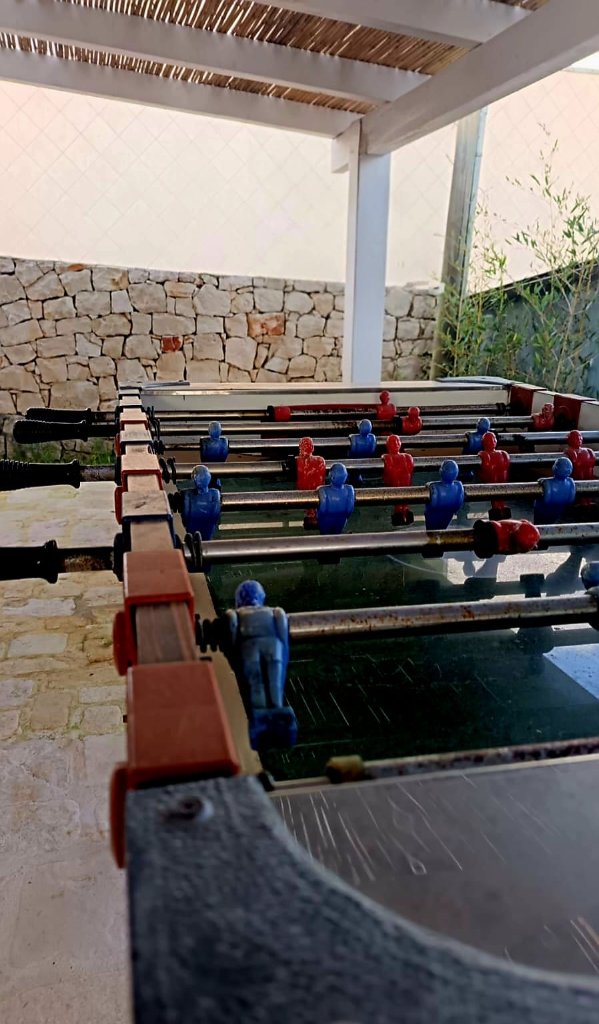 Vintage foosball table under pergola