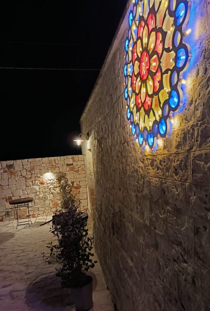 Illuminated decorative art on stone wall