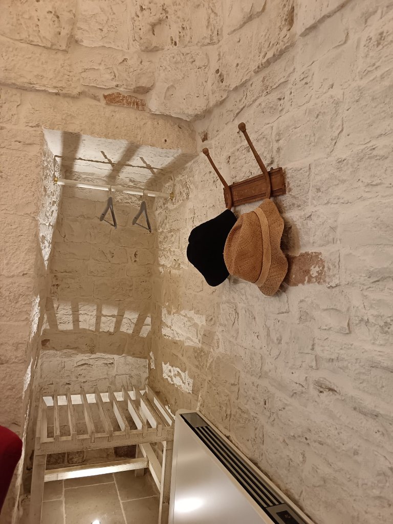 Trulli interior with coat hooks and seating