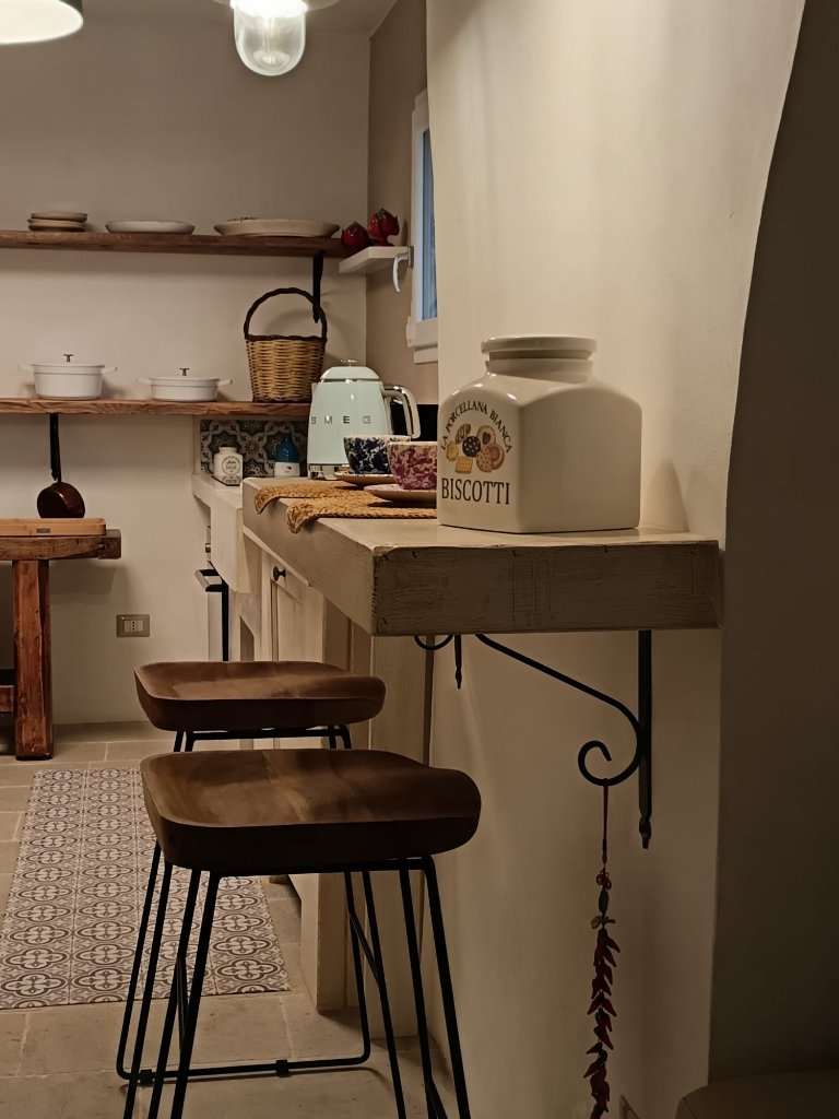 Modern kitchen with SMEG appliances and rustic charm