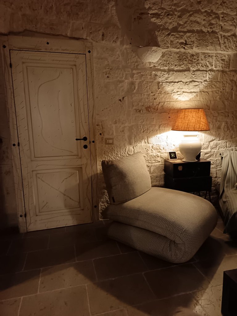 Cozy bedroom with stone walls