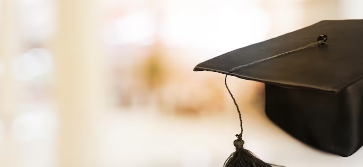 Happy graduate student in academic dress