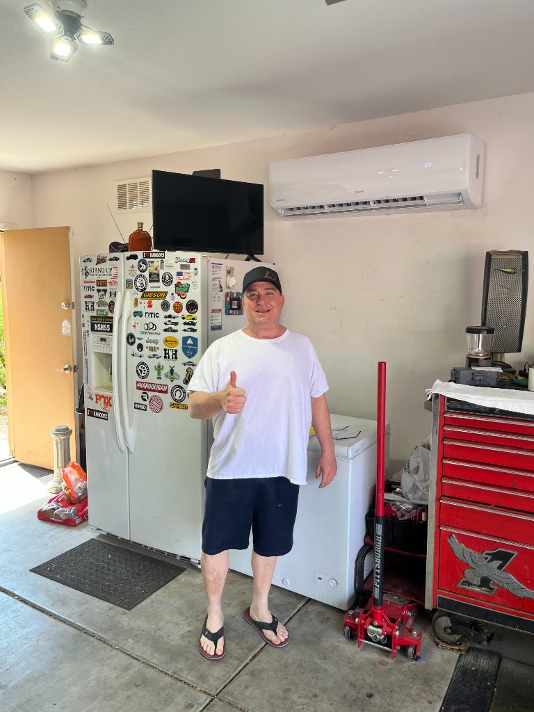 Satisfied customer with new mini split system in garage