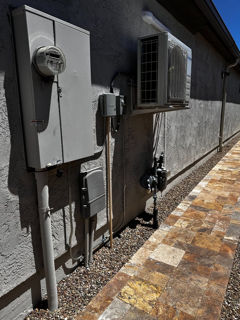 New Aurus mini split outdoor condenser installation on concrete pad Phoenix