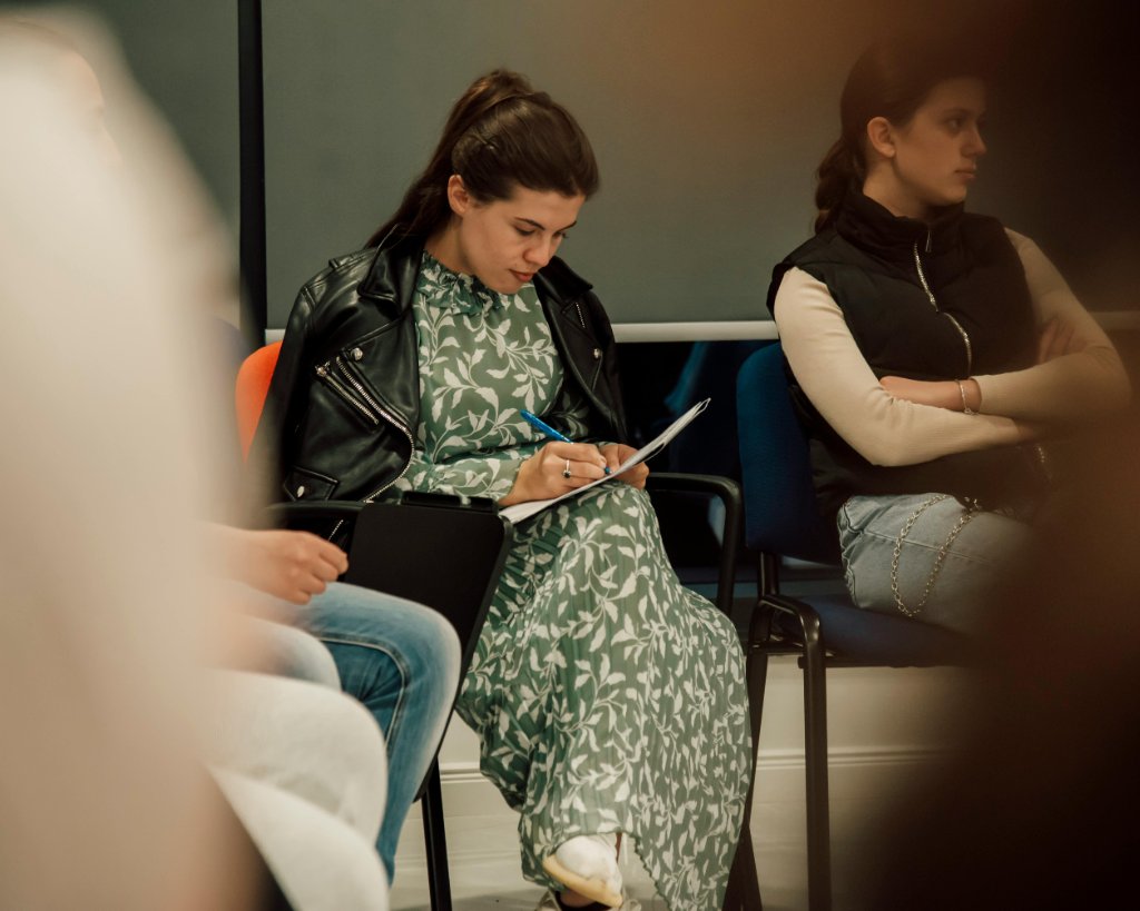 Woman journaling in workshop