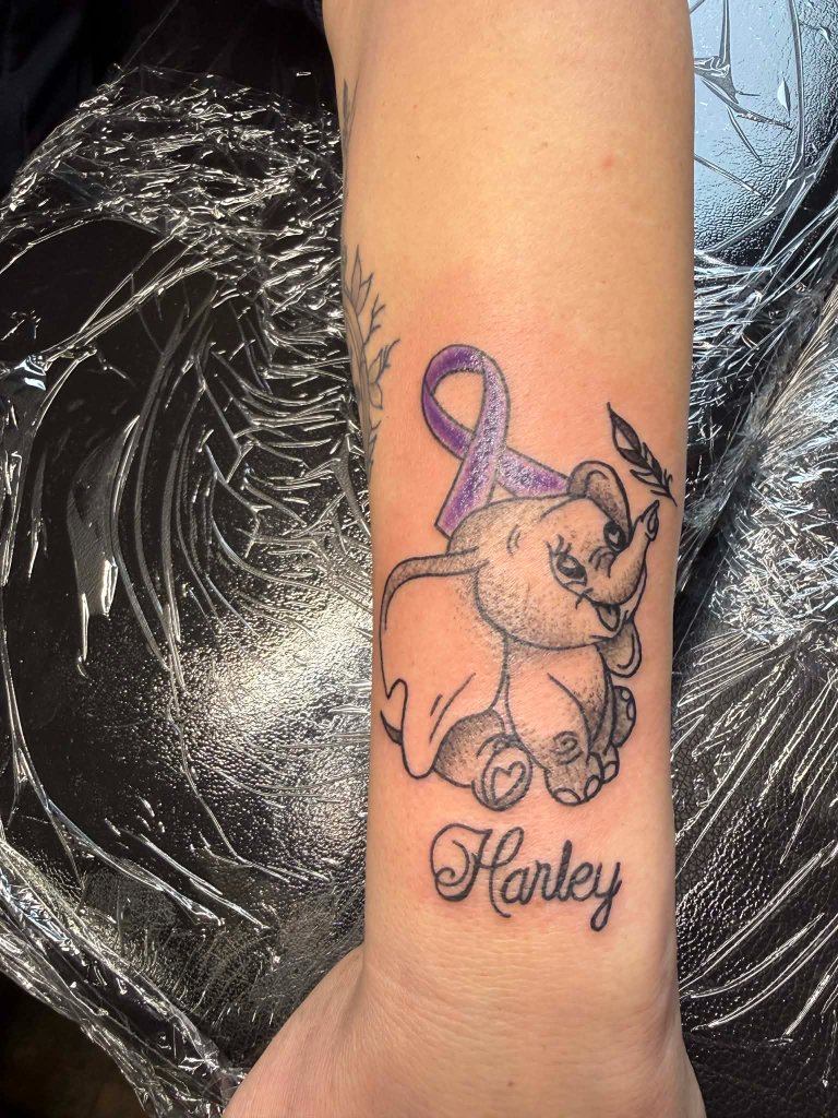 Elephant with purple ribbon