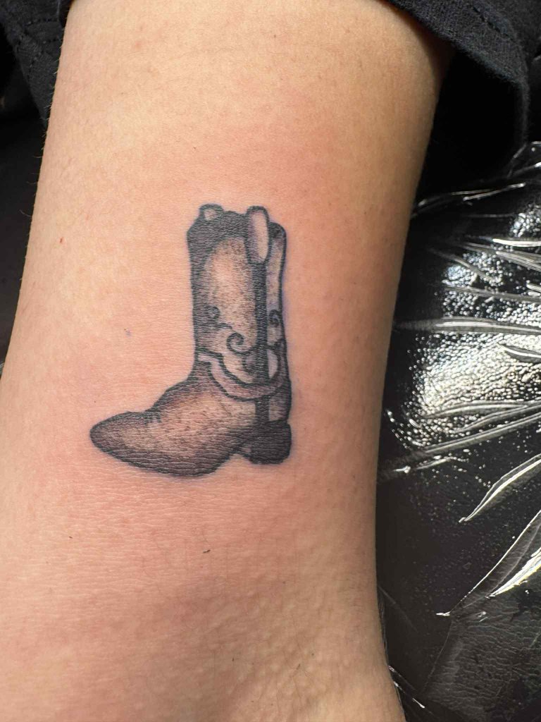 Cowboy boot tattoo