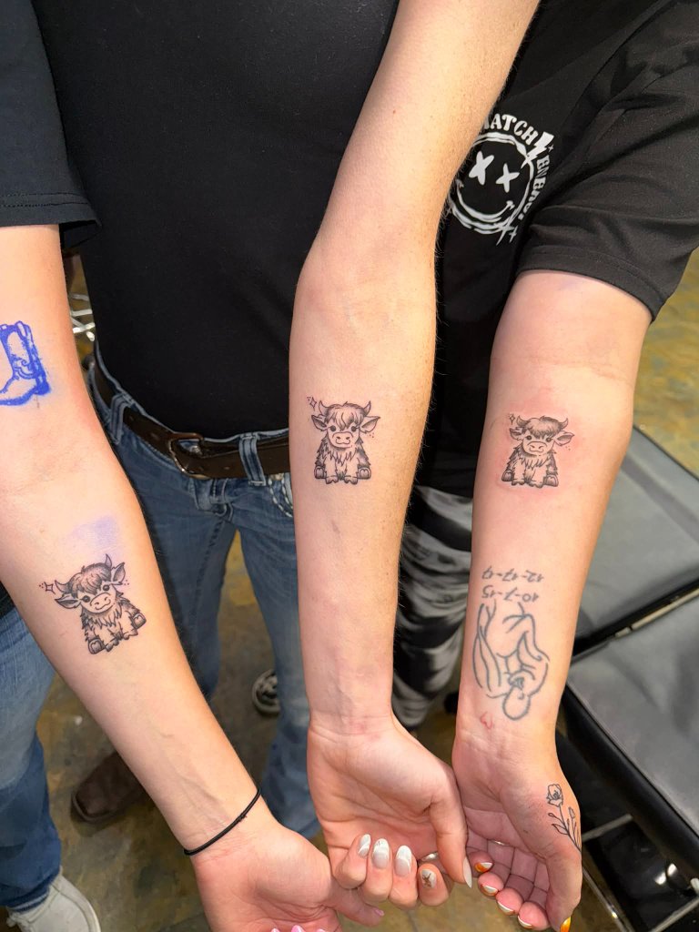 Matching Highland cow tattoos