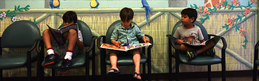 Children reading in waiting room