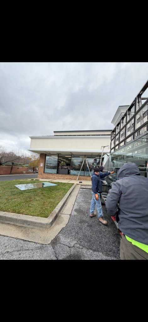 Commercial glass replacement in progress on a business property