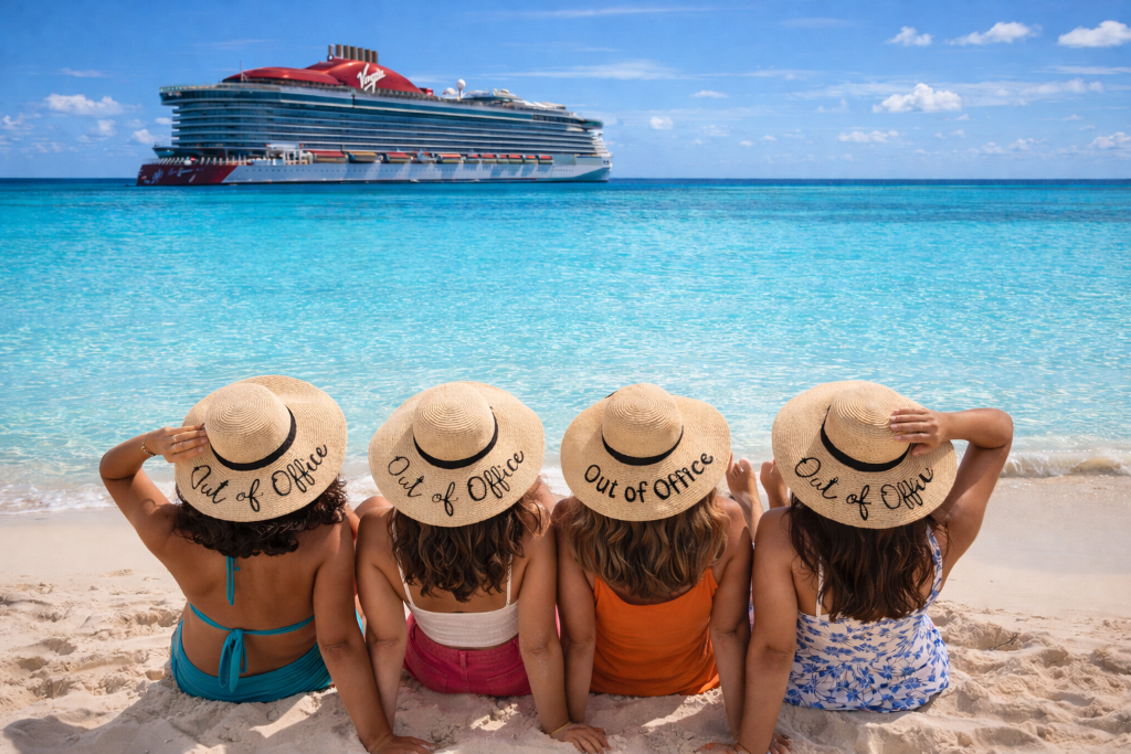 SAIL Leadership Intensive - Women leaders wearing Out of Office hats on Caribbean beach during Virgin Voyages retreat