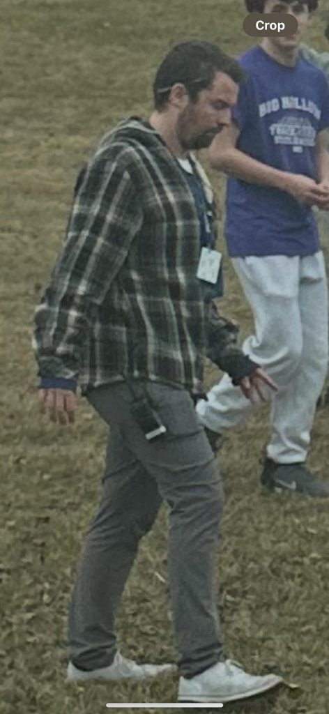 Staff member on school grounds during student protest
