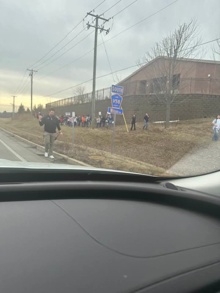 Wide view of student protest along roadside