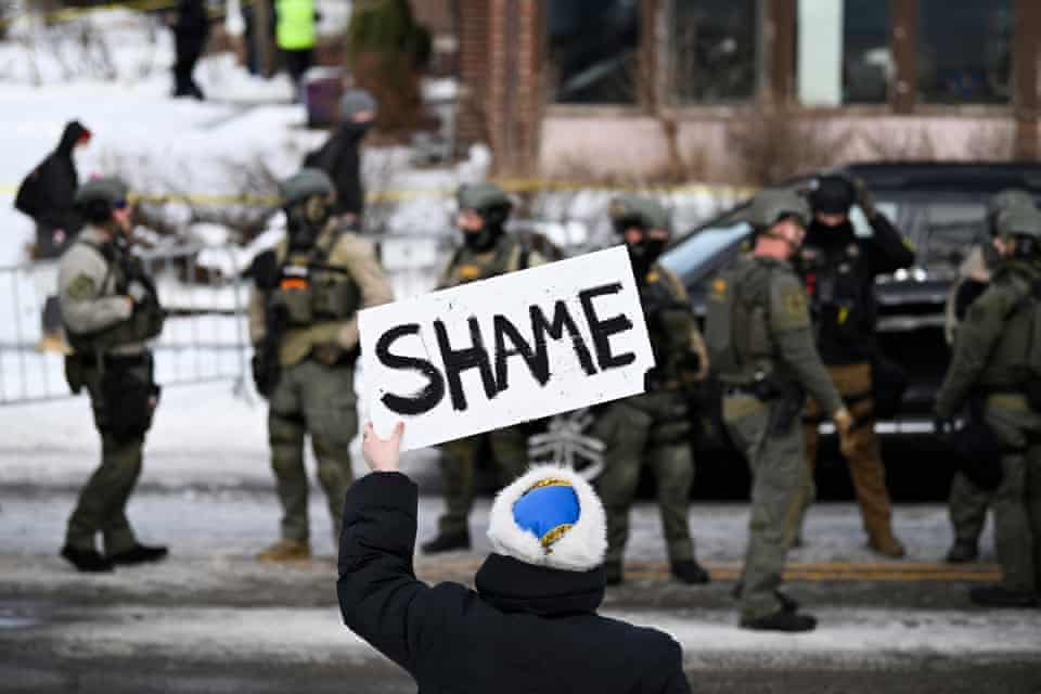 Protester with Shame Sign
