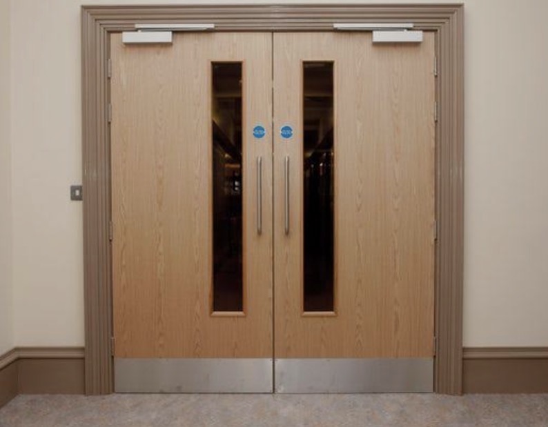 Fire door inspection in social housing block ensuring compliance with 2026 fire door standards