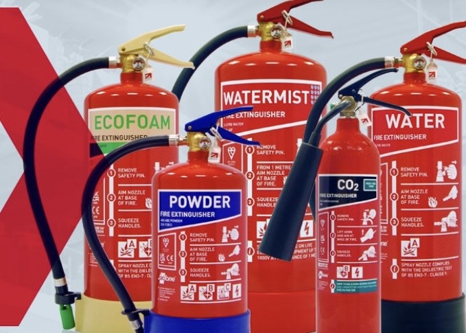 Competent engineer servicing portable fire extinguishers in commercial premises Norfolk