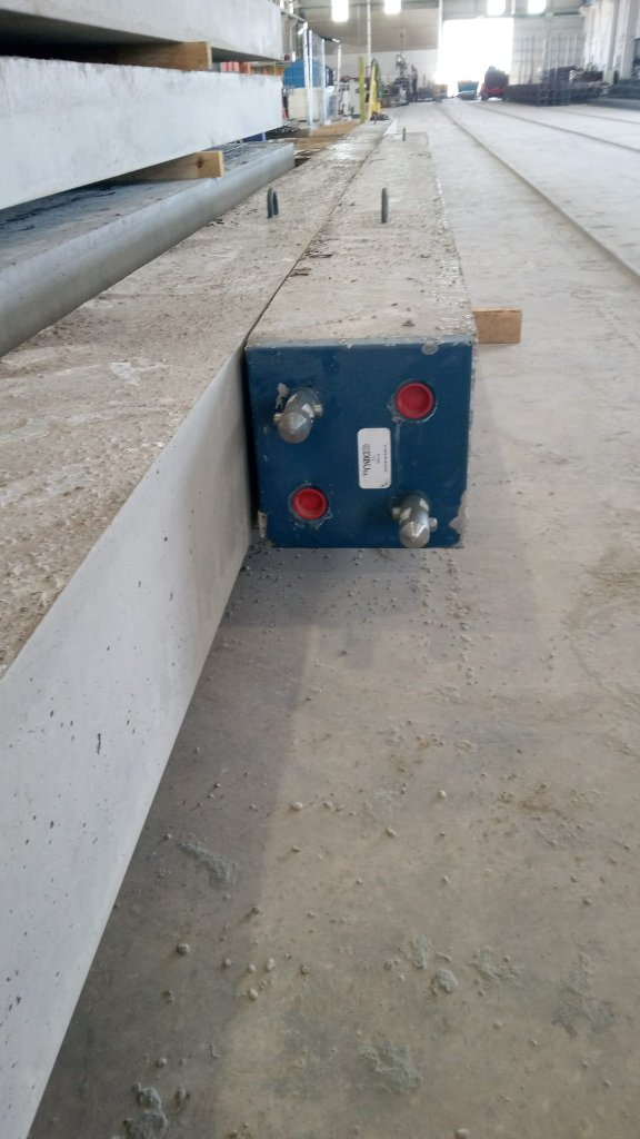 DI-BLOCK joint system installed in precast concrete piles on construction site, showing self-locking mechanism without external pins