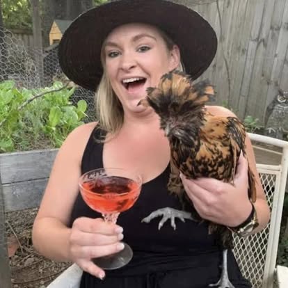 Happy visitor with chicken at City Chicks farm experience Samford Valley Brisbane