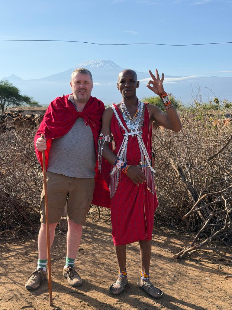 Martin on safari in Tanzania with Mount Kilimanjaro