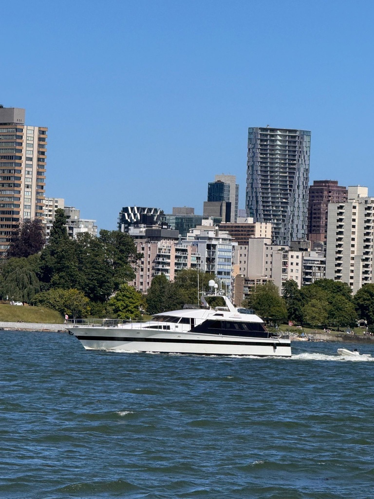The Abraxas cruising Vancouver Bay with city backdrop