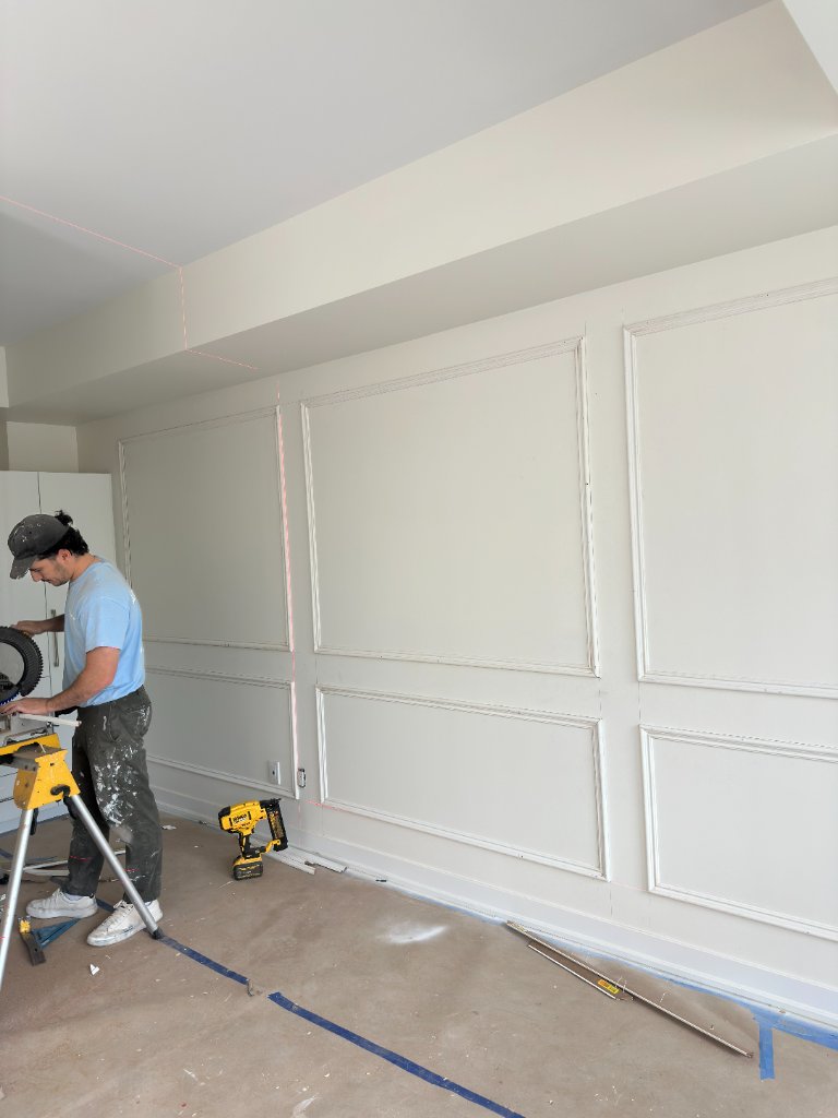 Professional painting contractor working in Toronto home