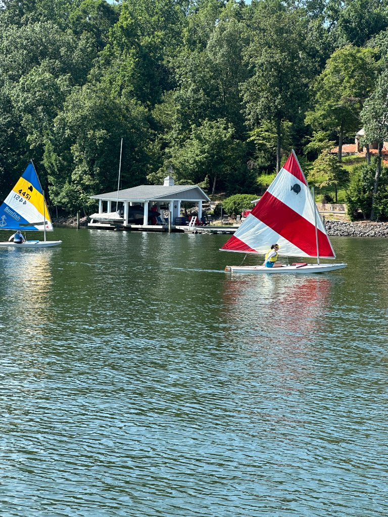 Sunfish sailboats on Lake Wylie during learn to sail clinic at Catawba Yacht Club, Charlotte NC