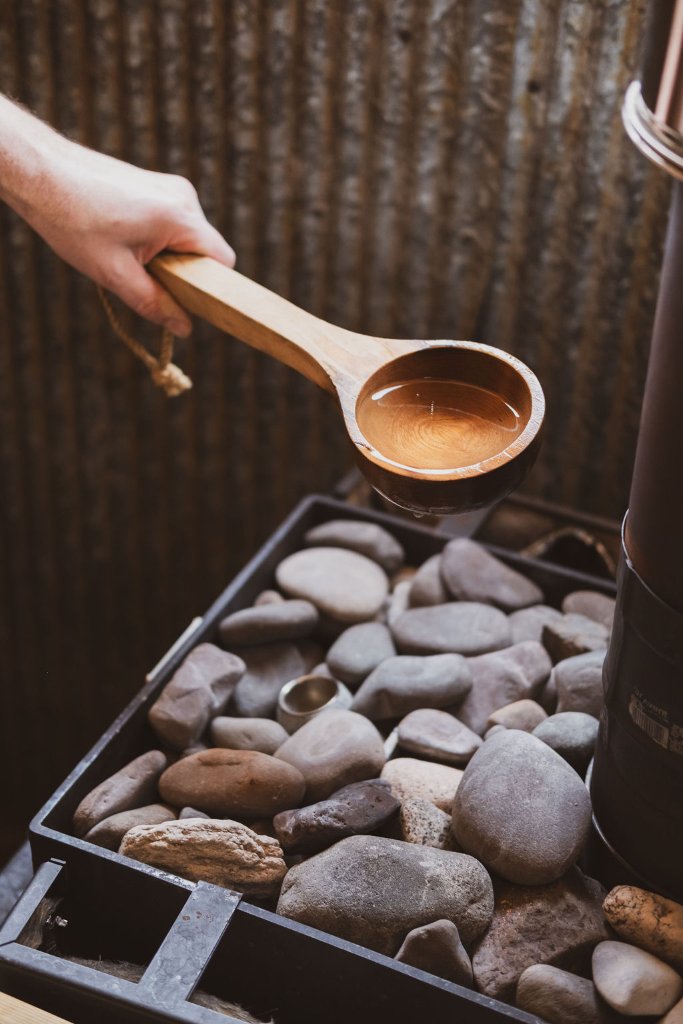 Traditional sauna ladle with water