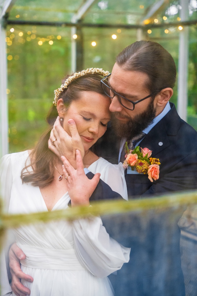 Emily and Josh sharing a kiss surrounded by fall color at Succop Nature Park, Butler, PA