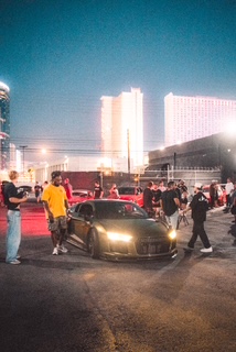 DRVN car meet crowd at night