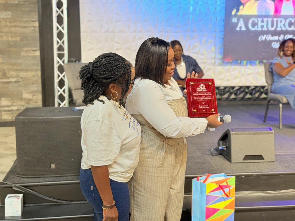 Award ceremony moment with community members