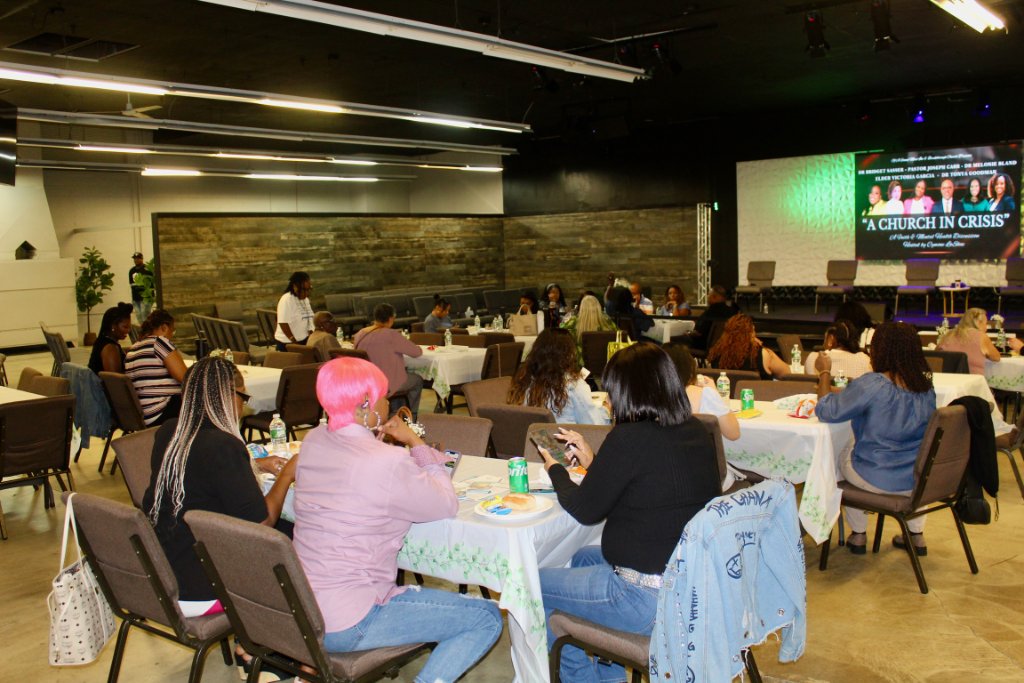 Community event with attendees engaged in discussion