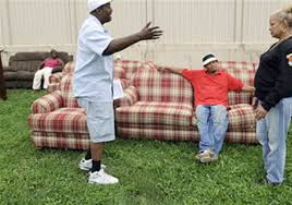 Hank Commodore helping family with furniture