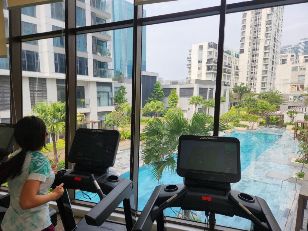 Gym with pool view