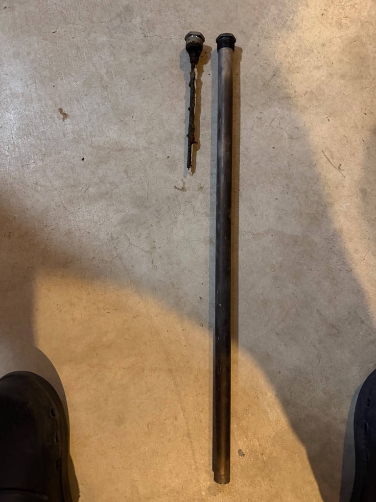Old vs new anode rod comparison - hot water tank maintenance