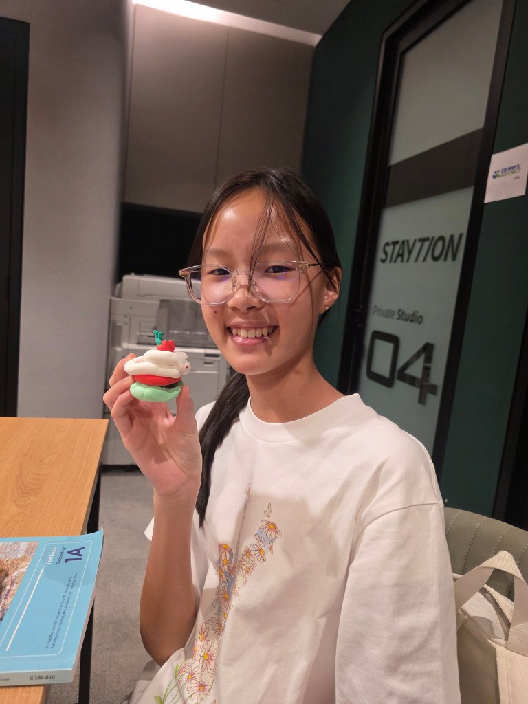 Student with clay pie