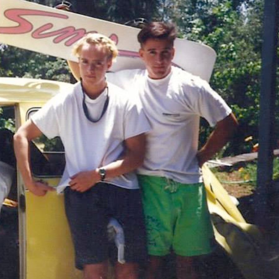 Brothers with surfboards