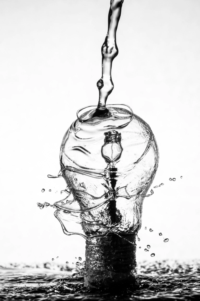 Water pouring into a lightbulb