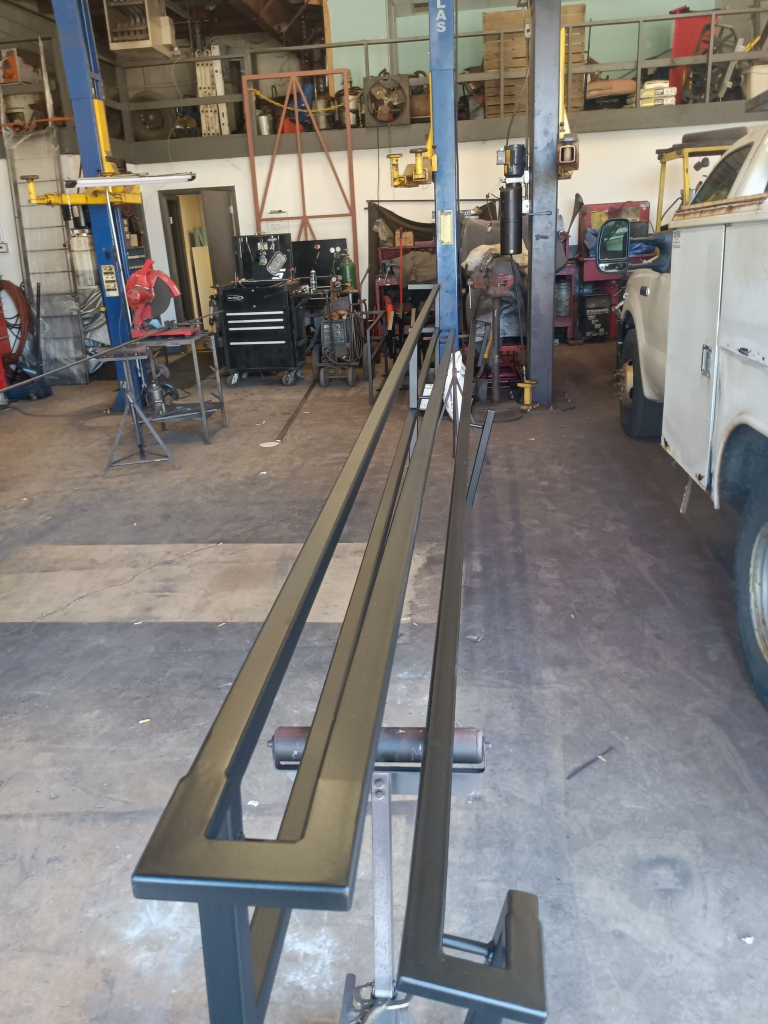 Custom fabricated handrail sections ready for installation.