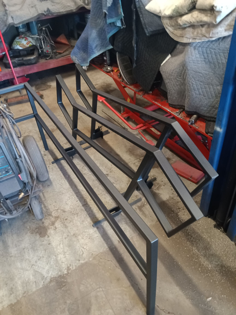 Custom steel stair railing being fabricated in shop