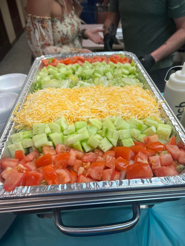 Catered BBQ event with full buffet setup