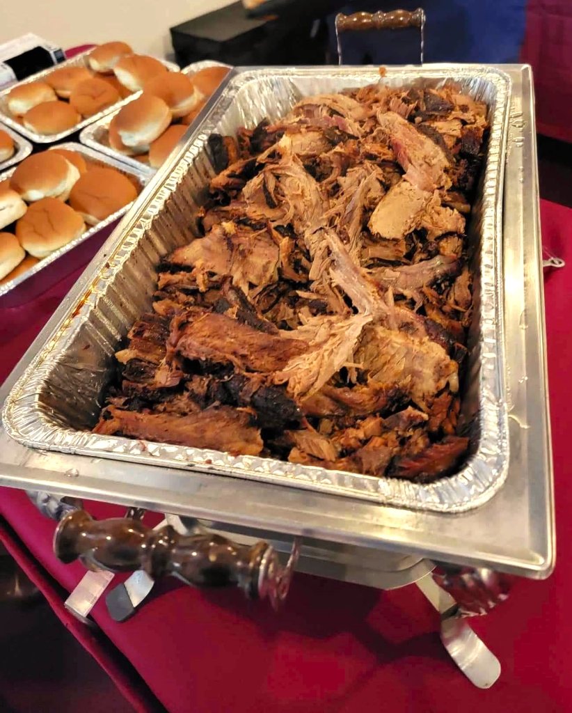 Delicious Southern-style BBQ catering spread with smoked meats, sides, and buffet setup by Stampede's Barbeque LLC