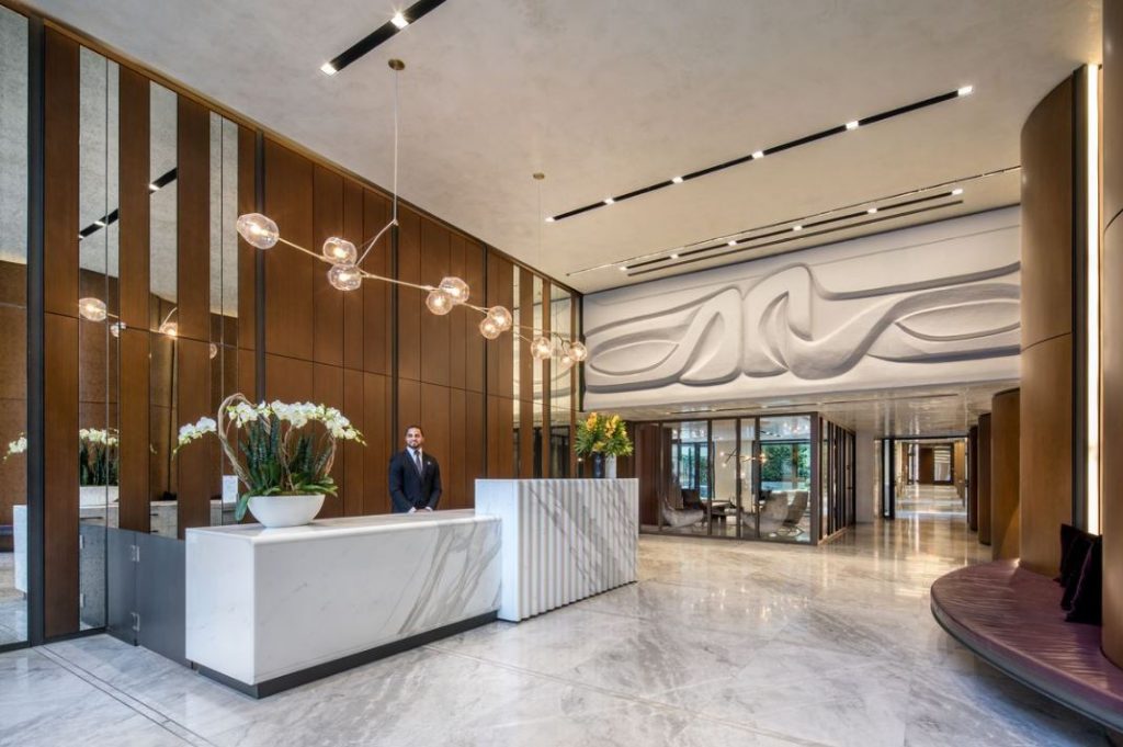 Luxury condo lobby with concierge desk