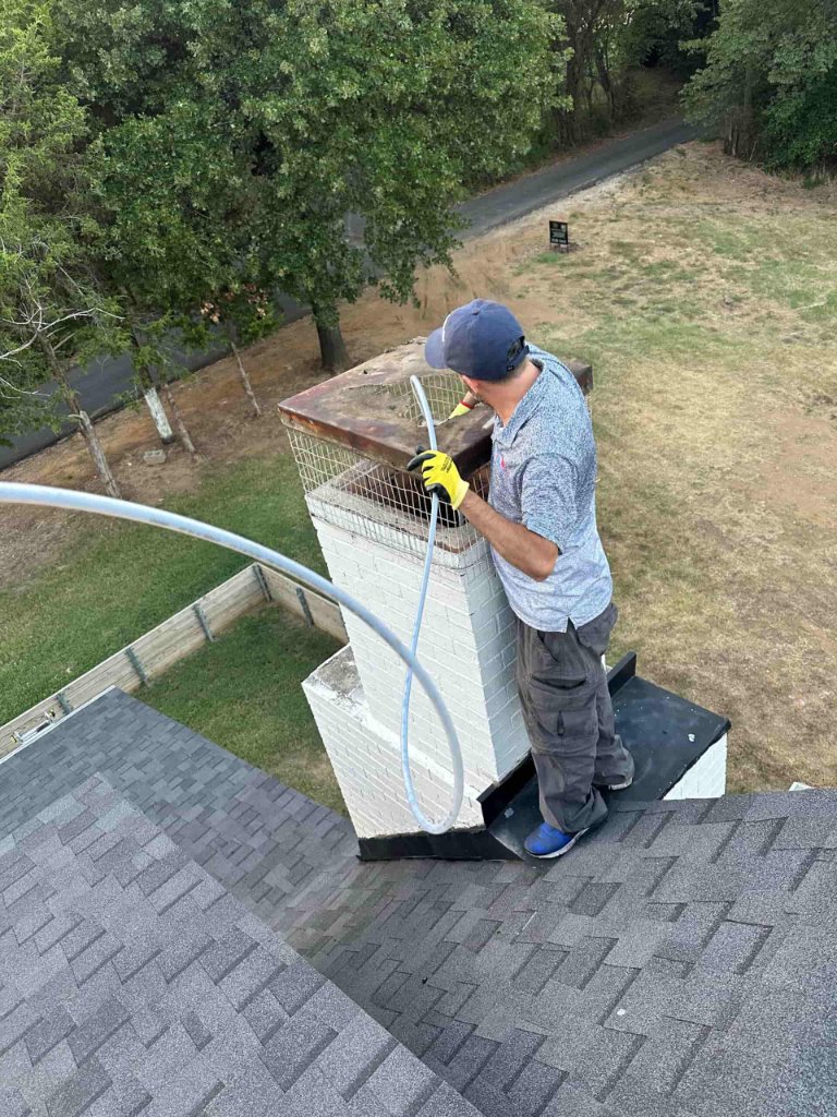 Technician working on chimney